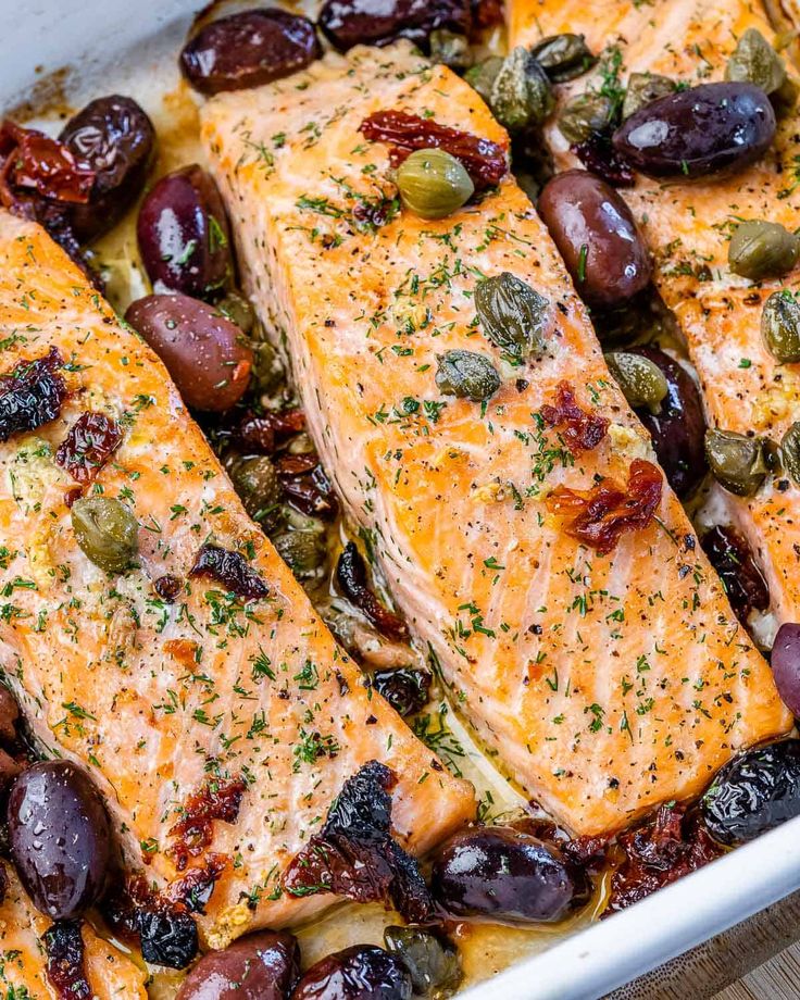 baked salmon and olives in a baking dish