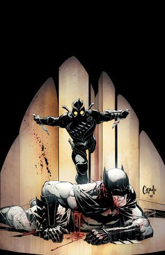 batman and catwoman on the ground in front of a wooden fence with blood all over it