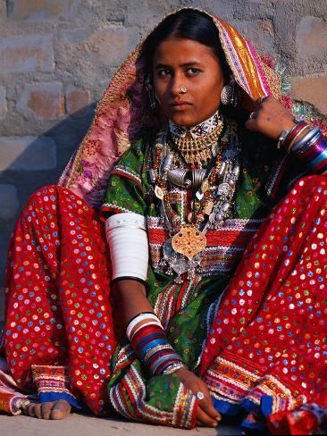 size: 24x18in Photographic Print: Ornately Dressed Megwar Tribe Woman Sits Next to Wall, Gujurat, India by Jaynes Gallery : Fine Art Garden Wedding Dresses, India Culture, Indian Woman, We Are The World, Folk Costume, World Cultures, India Fashion, Traditional Dresses, Traditional Outfits