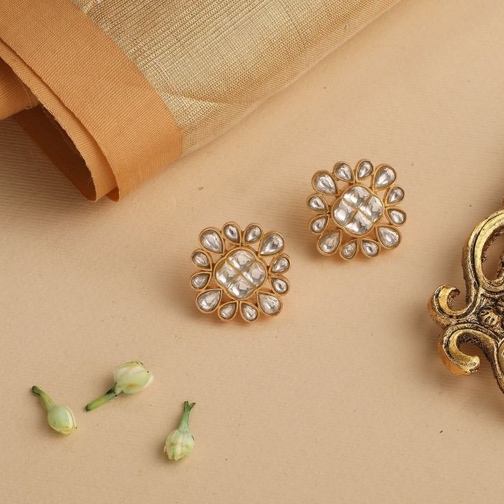 Description This pair of gold plated silver earrings is designed to portray a marigold in full bloom. Studded with glistening Jadau set stones these delicate and pretty stud earrings are ideal companions for statement neckwear. Product Information Metal: 925 Silver with 1.0 microns Gold Plating Length: 2.5 cm Stones: Semi precious stones Findings: Push back closure Jadau Set, Silver Stud Earrings, In Full Bloom, Gold Plated Silver, Semi Precious Stones, Silver Earrings Studs, Silver Studs, Gold Plating, Semiprecious Stones