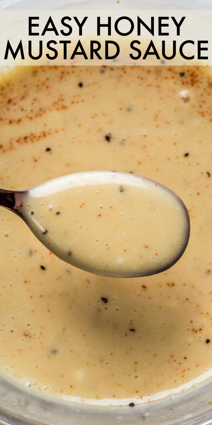 a spoon full of homemade mustard sauce in a bowl with the words easy honey mustard sauce on it