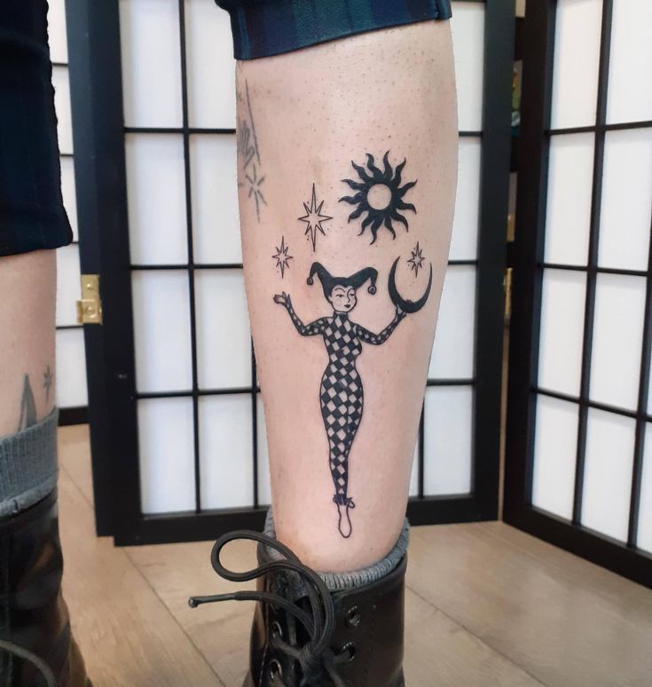 a person with a tattoo on their leg