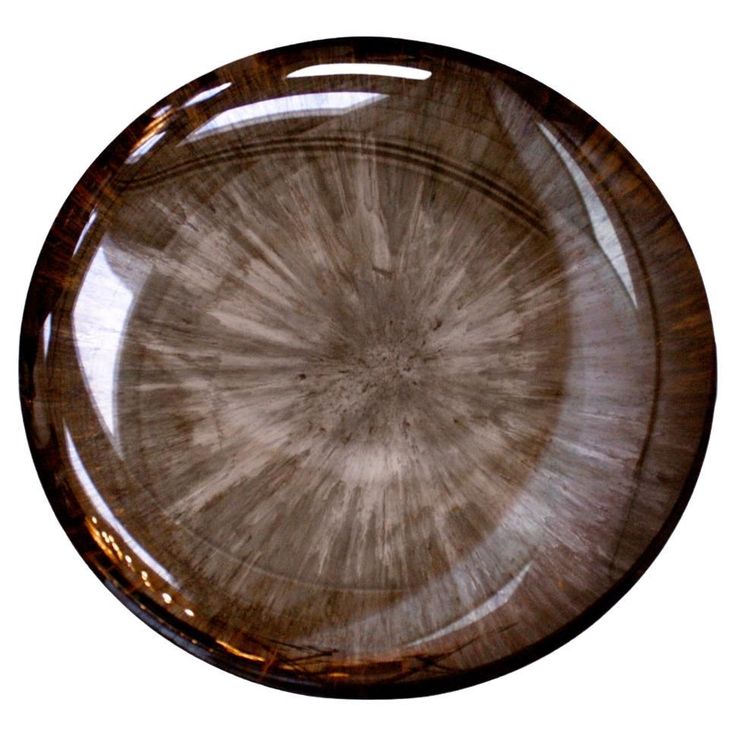 an image of a plate that is brown and white with some lines on the surface