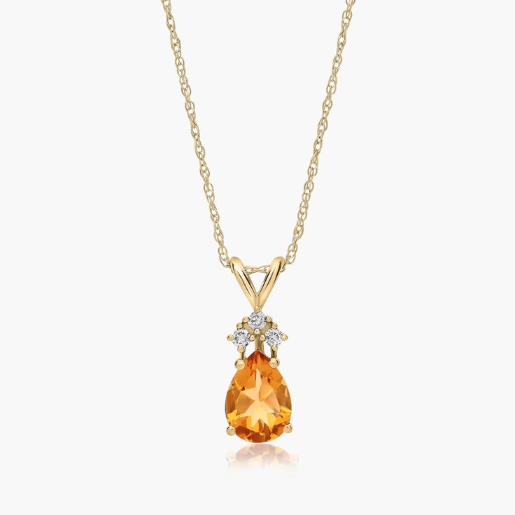 14K Yellow Gold Pear Shaped Citrine & Tri-Diamond Pendant Necklace. Channel your inner royal in this luxurious pendant necklace. Featuring a beautiful pear shaped gemstone with three diamonds at its top, this expertly crafted necklace exudes elegance. Pair it with the matching earrings for the ultimate shine. Diamond Pendant Necklace, Fine Jewellery Necklace, Matching Earrings, Diamond Pendant, Gemstone Necklace, Pear Shaped, Pendant Jewelry, Citrine, Pear