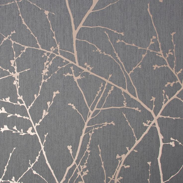 the branches of a tree against a gray background with white and light brown paint on it