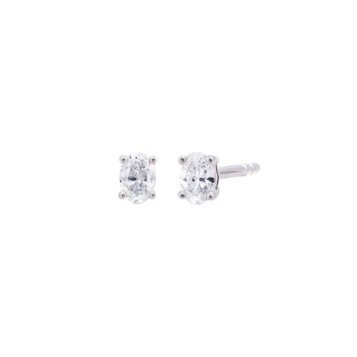 Introducing the Adina Eden Lab Grown Diamond Oval Four Prong Stud Earrings, a stunning blend of elegance and sustainability. Crafted from luxurious 14K gold and 14K white gold, these earrings feature a single oval brilliant-cut lab-grown diamond in each stud. With a color grade of G and a clarity of VS1, these diamonds offer exceptional brilliance and clarity. Available in five carat weights—0.25 CT, 0.50 CT, 1 CT, 1.5 CT, and 2 CT—these earrings cater to various style preferences. Finished with Classic White Gold Earrings With Timeless Design, Classic White Gold Earrings, Modern Oval Diamond Earrings With Prong Setting, Elegant Oval Diamond White Diamond Earrings, Elegant Oval Brilliant Cut Diamond Earrings, 14k Gold Oval Earrings With Brilliant Cut, Modern Oval Brilliant Cut Diamond Earrings, Elegant Oval Diamond White Earrings, Timeless Oval Diamond Earrings