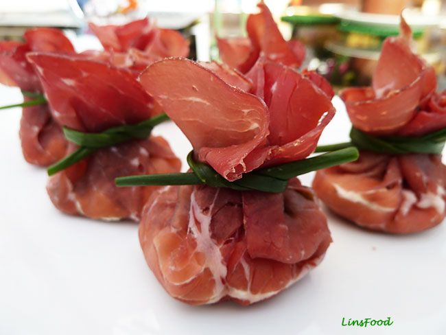 small appetizers are arranged on a white plate