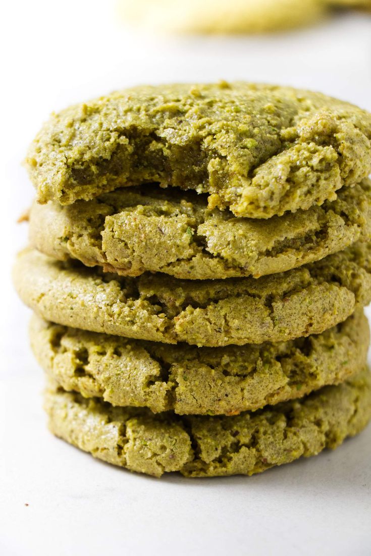 a stack of green cookies sitting on top of each other