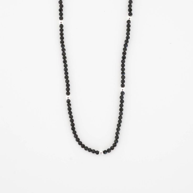 This beautiful Obsidian Beaded Necklace is edgy. elegant, and eye-catching, making it perfect for wearing by itself or layered with a simple chain necklace. The strand of pearls is punctuated with your choice of gold or silver beads for added interest. Note: We reinforce the necklace’s center silk cord with hidden knots—if your necklace breaks, most of the beads will remain intact and unaffected. For maximum life, we recommend you do not wear this necklace in water or during any rigorous activit Elegant Gemstone Beads Necklaces For Layering, Single Strand Necklaces With Round Beads For Layering, Minimalist Beaded Onyx Jewelry, Minimalist Onyx Beaded Jewelry, Minimalist Tiny Beaded Necklaces For Layering, Minimalist Onyx Bead Jewelry, Minimalist Onyx Round Bead Jewelry, Minimalist Pearl Necklace With Beaded Chain, Adjustable Black Beaded Necklace With Pearl Chain