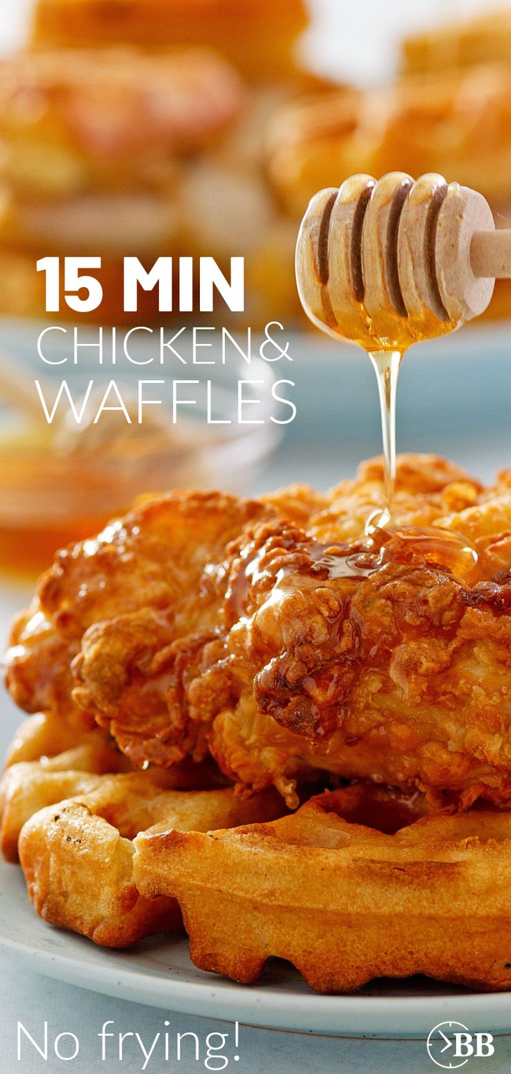 chicken and waffles with honey being drizzled over them