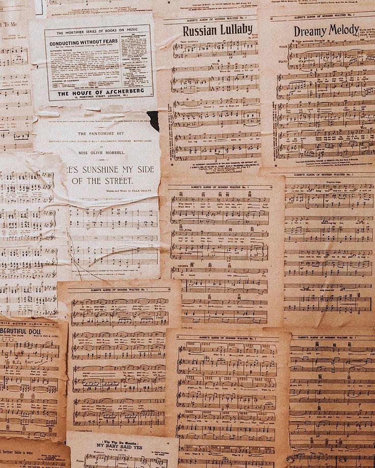 old sheet music written in many languages on a piece of paper that has been torn down