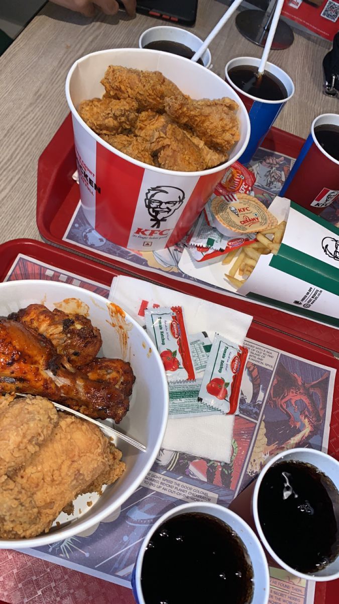 two trays filled with different types of food