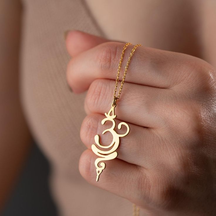 14K Solid Gold Breath Necklace for women, spiritual necklace for women, Hindu meditative yoga pendant, Sanskrit necklace silver, Elegant Silver Sanskrit Necklace, Timeless Spiritual Charm, Gold OM Necklace, This beautiful Sanskrit Symbol reminds us to breathe in and out, to pause and calm our minds. Hindu meditative yoga pendant symbol for 'om' (ohm) sacred syllable Discover the beauty and spiritual depth of our exquisite Sanskrit necklace, handcrafted with precision and love. This captivating p Meditative Yoga, Breathe Symbol, Yoga Symbol, Women Spiritual, Yoga Symbols, Yoga Pendant, Om Necklace, Spiritual Necklace, Yoga Necklace