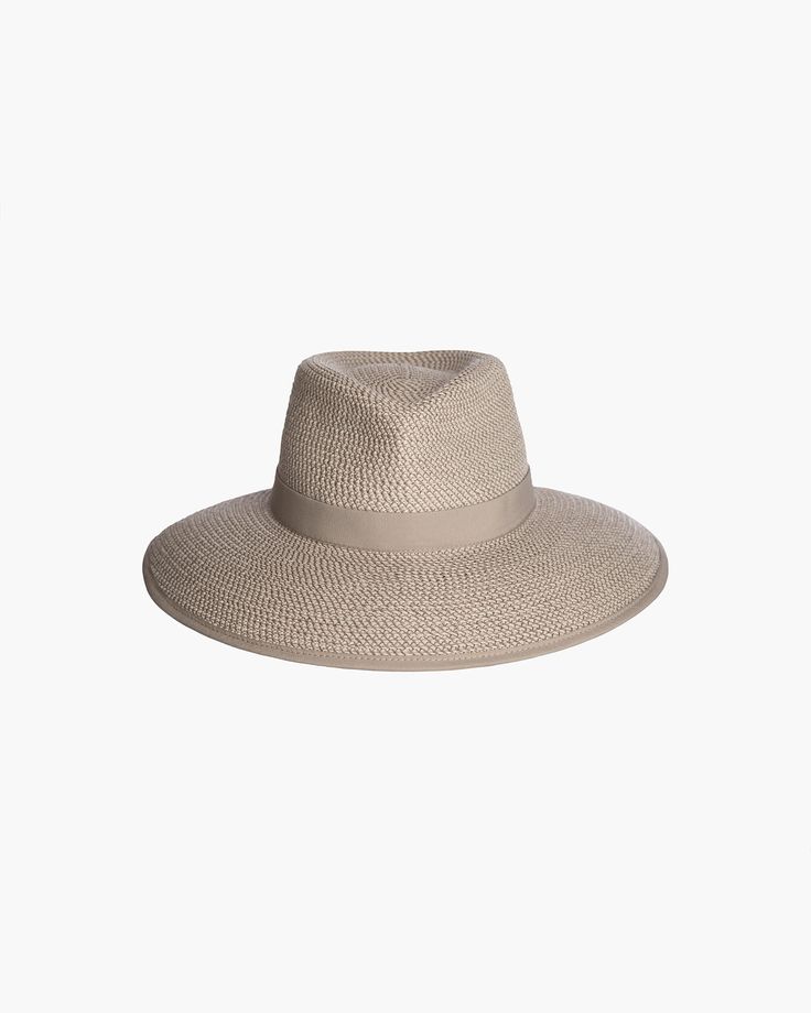 The Suncrest visor is a stylish hybrid of a classic fedora and a practical visor with a generous 4-inch brim. This fashionable Squishee® straw hat is trimmed with grosgrain ribbon for a chic, polished look. You'll turn heads wherever you go this summer. Our revolutionary Squishee® material is man-made straw fabric constructed from partially recycled plastics. This environmentally friendly material resembles genuine raffia straw, but it offers several practical advantages including increased dura Small Leather Accessories, Straw Visor, Winter Bags, Gold Sand, Rain Hat, Visor Hat, Women's Headwear, Navy Linen, Straw Bags