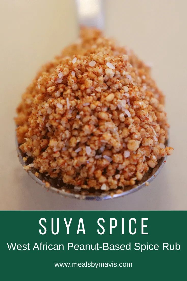 a spoon with some food in it on top of a white table and the title says suya spice west african peanut - based spice rub