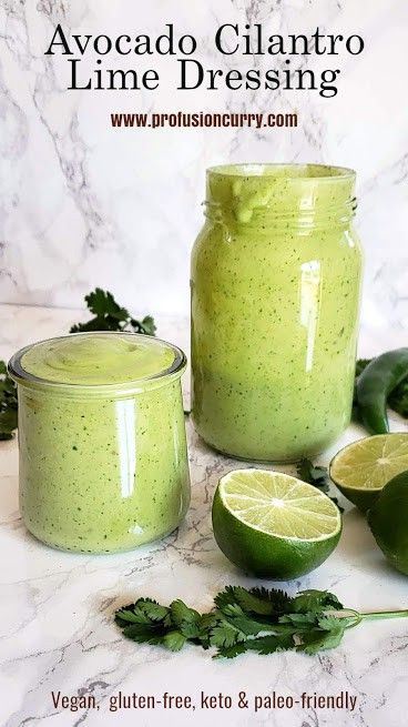 avocado cilantro lime dressing recipe in a jar and sliced limes