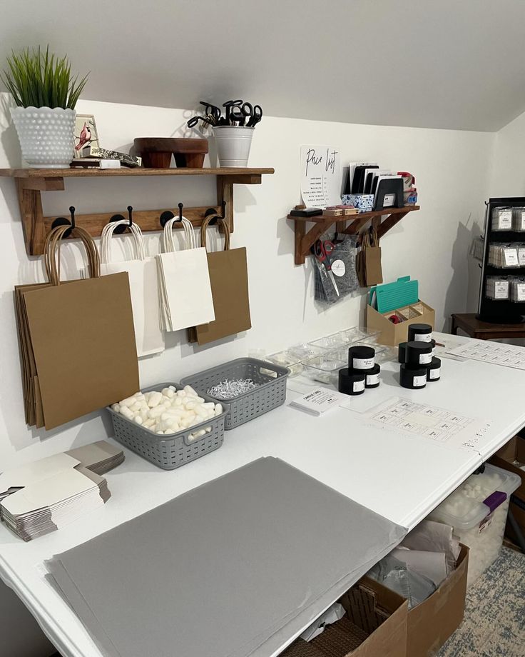 a craft room with lots of crafting supplies on the table