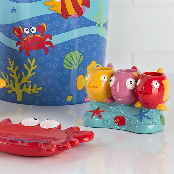 the toys are all in different colors and sizes, including one with fish on it