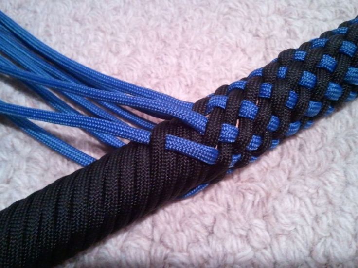 two blue and black braided ropes laying on top of each other