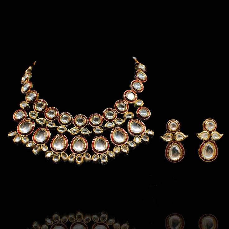 A dreamy set merging traditional with contemporary! Exude glamour in this trendy set encrusted with kundan stones over an enameled base. The look includes necklace and a pair of matching earrings. Approximate earrings length is 1.5". Gold-plated on high-quality brass as base metal. Made by order. Kindly allow 4-6 weeks for the delivery of this item. For custom or urgent requests, please contact support@alacouture.com. *Please Note: We use faux stones and beads in all of our jewelry. Faux Stone, Base Metal, Matching Earrings, Statement Necklace, Gold Plate, Plating, Brass, Beads, Stone