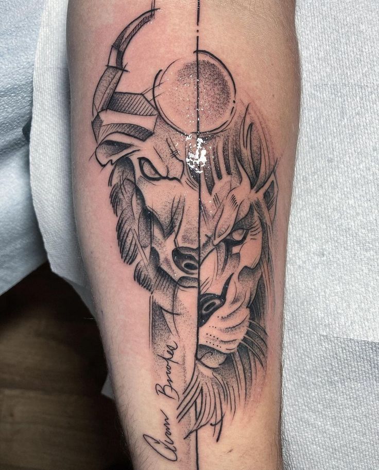 a man's arm with a lion and arrow tattoo on it