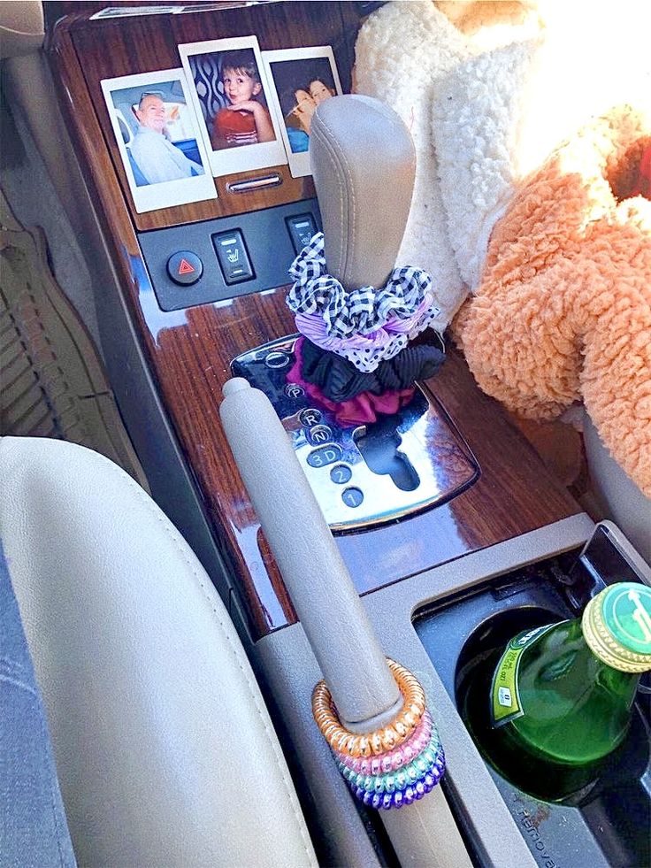 there is a teddy bear and other items in the car