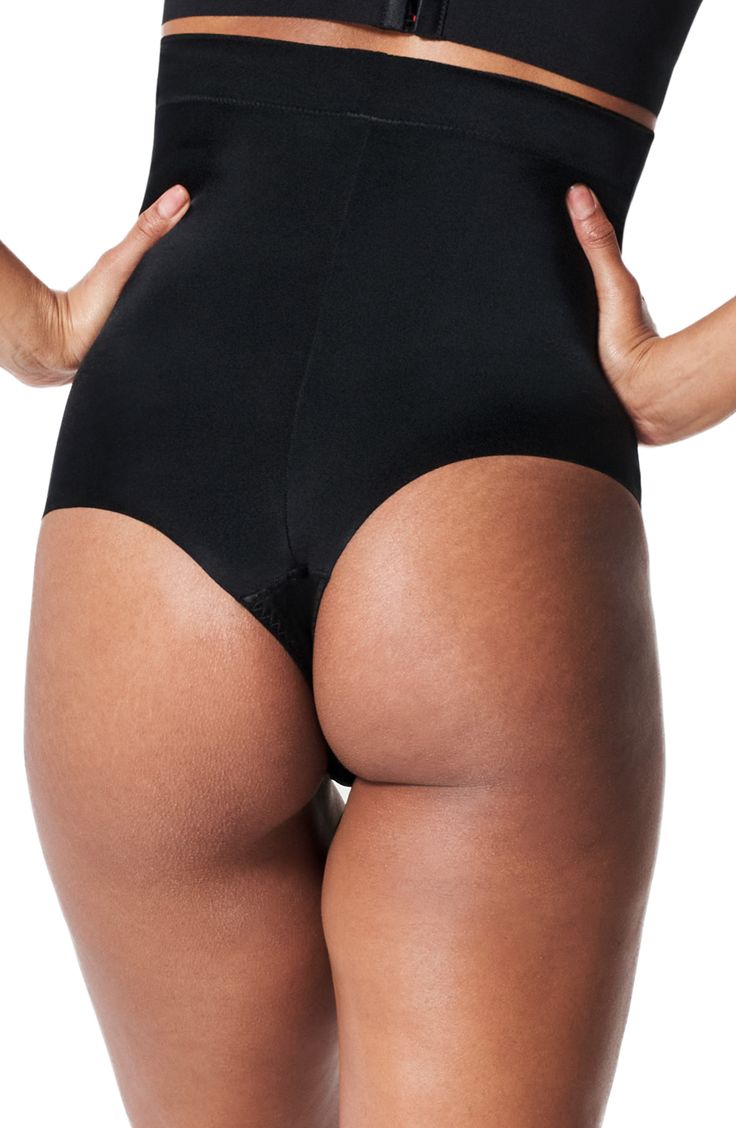 This lightweight thong compresses and smoothes with 24/7 comfort and no panty lines. Cotton-lined gusset 51% elastane, 49% nylon Dry clean or machine wash, dry flat Imported Full Coverage Stretch Shapewear Bottoms, Stretch Full Coverage Shapewear Bottoms, Stretch Shapewear With Moderate Back Coverage, Black Micro-elastic Soft Touch Shapewear, Solid Shapewear With Moderate Back Coverage, Compressive Shapewear With Moderate Back Coverage, Supportive Brief Bottoms With Moderate Back Coverage, High-cut Leg Shapewear With Contoured Waistband, Micro-elastic Full Coverage Shapewear With Soft Touch