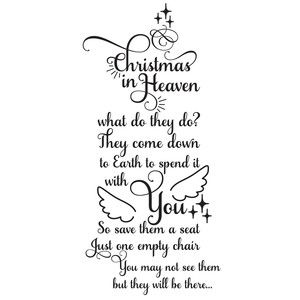 a cross with the words christmas in heaven on it and an image of two doves above