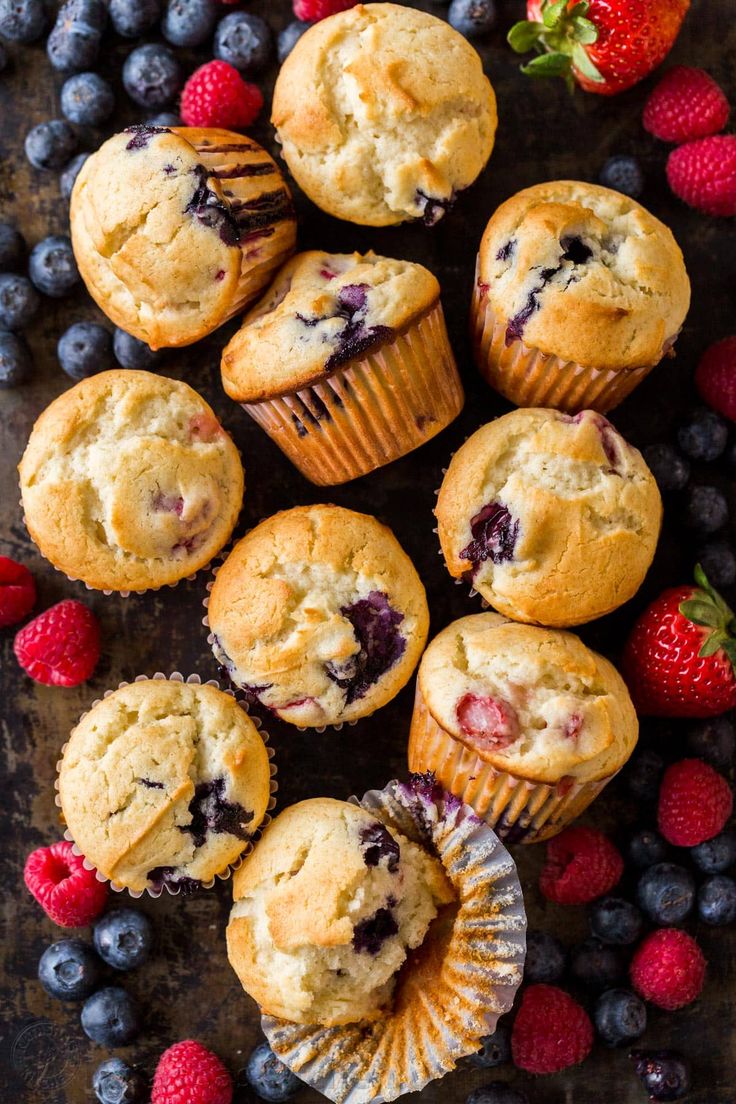 blueberry muffins with fresh berries on the side