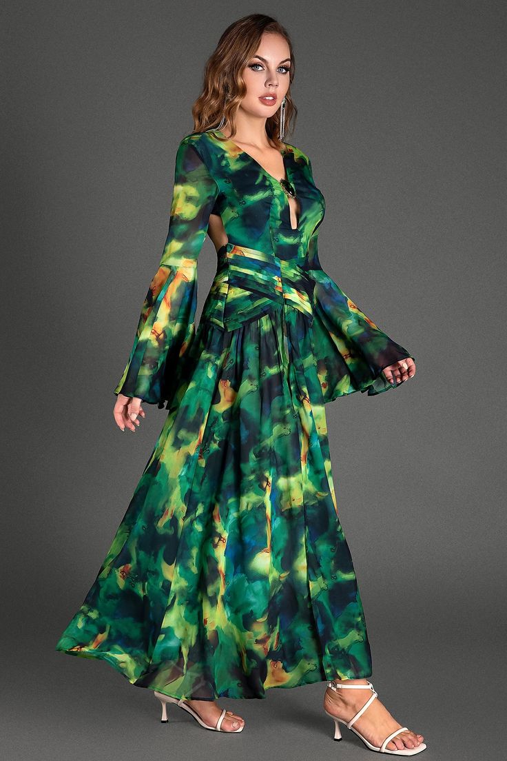 Radiate elegance in this emerald green, diamond-studded maxi floral dress with flared sleeves, intricate prints, and an alluring open back. The lush material adds to your charm, making it ideal for formal evenings, special events, and memorable gatherings. Handmade customization Fabric composition: 90% polyester fiber, 10% spandex Washing method: hand wash or dry clean Popular elements: printed Chic Green Gala Gown, Chic Green Gown For Gala, Green Silk Cocktail Maxi Dress, Green Silk Maxi Dress For Cocktail, Green Asymmetrical Maxi Dress For Party, Green Backless Maxi Dress For Evening, Elegant Green Backless Maxi Dress, Green Silk Cocktail Gown, Green Silk Gown For Cocktail