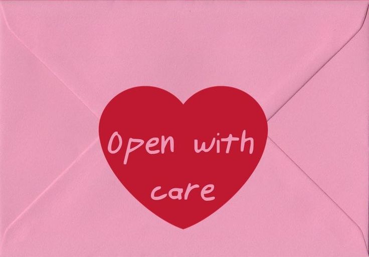 an open envelope with a red heart and the words'open with care'written on it