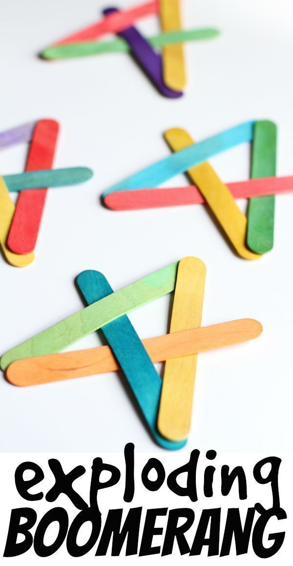 four pops sticks are arranged in the shape of an x on a white table top