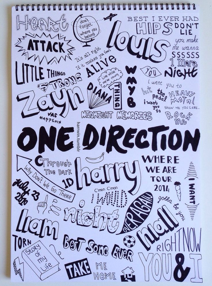 a spiral notebook with the words one direction written in black and white on top of it