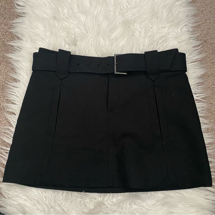 New With Tags Comptoir Des Cotonniers Fabiola Compact Black Mini Skirt Two Front Pockets & Belt Clothes That Hang Just Right, A Hint Of Casualness, Effortless Elegance, The Boldness Of Mix & Match: It's All In Comptoir Des Cotonniers' Dna. For Every Season, A Wardrobe That's 100% In Tune With The Times. Pieces That Stand Out From The Crowd With Their Unique Allure, Pieces To Combine In A Casual Style For Everyday Wear Our Principles Remain The Same: Easy-To-Wear Elegance, Specialist Know-How And High-waist Skirt With Belt For Night Out, High Waist Skirt With Belt For Night Out, Belted High Waist Mini Skirt For Party, Black Belted Skirt For Work, Fitted Belted Skirt For Night Out, Black Belted Skirt For Night Out, Workwear Mini Skirt With Belt, Workwear Skort With Belt Loops, Black Workwear Skort With Belt Loops