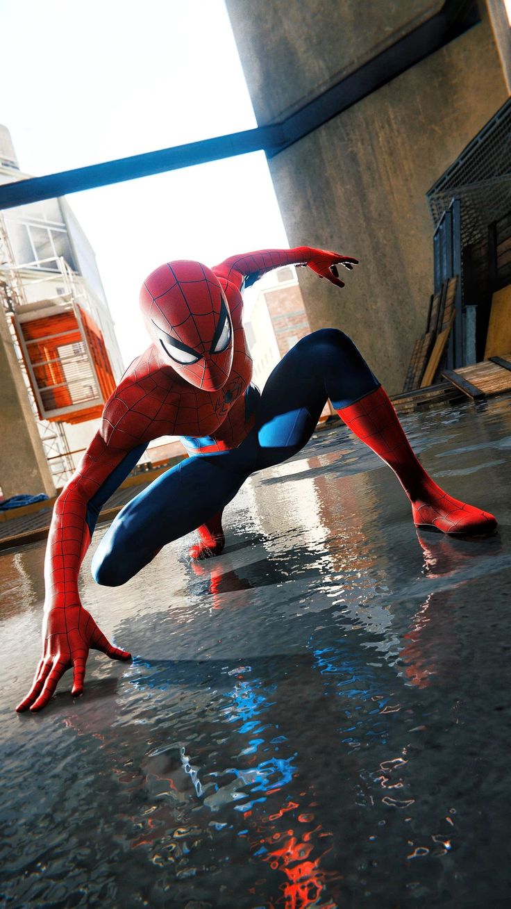 the amazing spider - man is in action on his knees