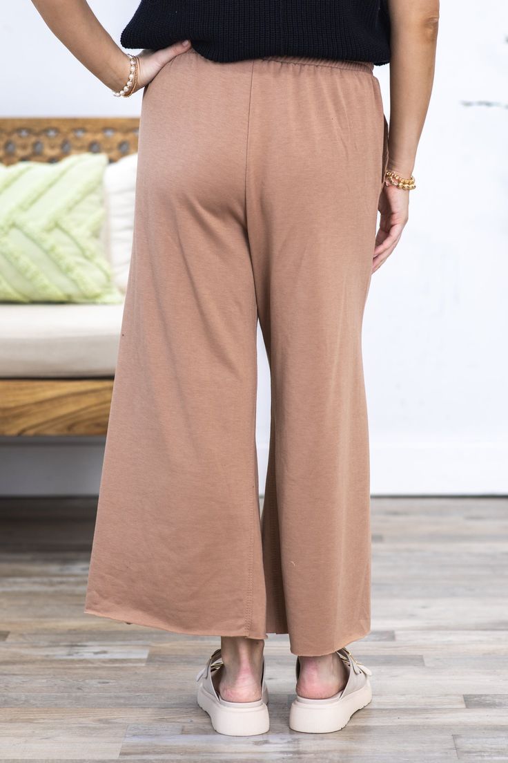 Product Details Color/Wash: Mocha Rise: High Rise Style: Pull On Elastic Tie Waist Brand: First Love Material and Care 87% Cotton 9% Rayon 4% Spandex Machine Wash Warm Tumble Dry Low Size and Fit Small: Waist 28" Rise 12.5" Inseam 23.5" Medium: Waist 30" Rise 13" Inseam 23.5" Large: Waist 32" Rise 13.5" Inseam 24" Photo model is 5'4 and wearing a size small Video model is 5’8 and wearing size small Stretch Brown Wide Leg Pants For Loungewear, Brown Stretch Ankle-length Wide Leg Pants, Brown Full Length Wide Leg Pants For Loungewear, Brown Full Length Wide Leg Loungewear Pants, Brown High Waist Yoga Pants, Brown Wide Leg Ankle-length Pants For Loungewear, Brown Ankle-length Wide Leg Pants For Loungewear, Comfortable Brown Pants With Elastic Waistband, Brown Elastic Waistband Bottoms For Loungewear