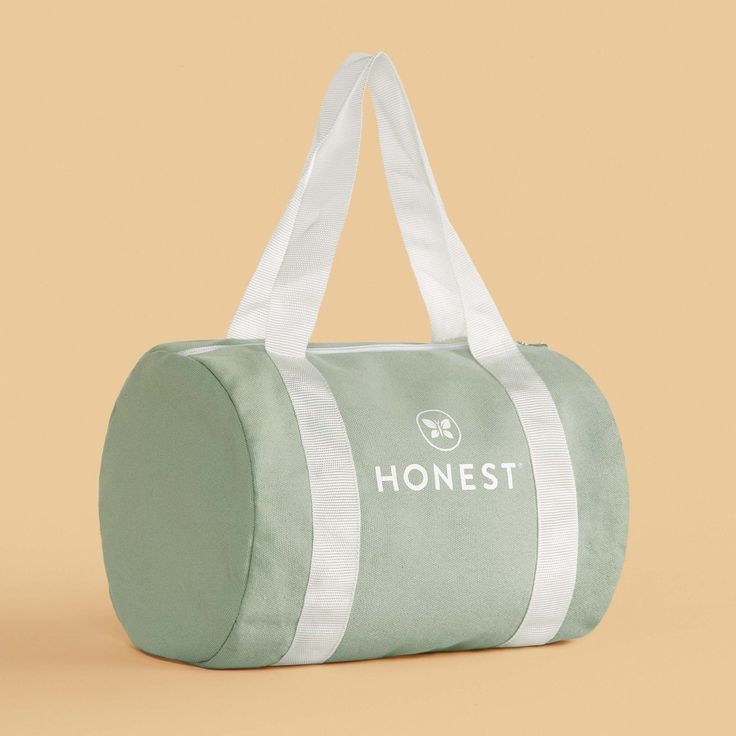 Our adorably sized Honest Duffel Bag lets you (or your mini!) stash + carry your Honest essentials to go in a sporty style! Large Capacity Sporty Travel Accessories For Everyday Use, Sporty Large Capacity Travel Accessories For Everyday Use, Sporty Travel Accessories With Large Capacity For Everyday Use, Green Large Capacity Sporty Travel Bag, Sporty Green Travel Bag With Large Capacity, Green Sporty Bag For Daily Use, Sporty Green Large Capacity Travel Bag, Sporty Green Bag For Daily Use, Practical Green Gym Bag