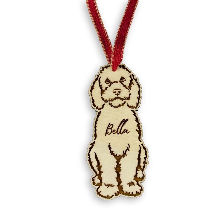 a wooden ornament with a small dog on it's back and name