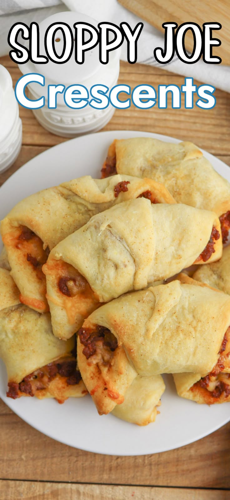 there is a white plate that has some food on it and the title says sloppy joe crescents