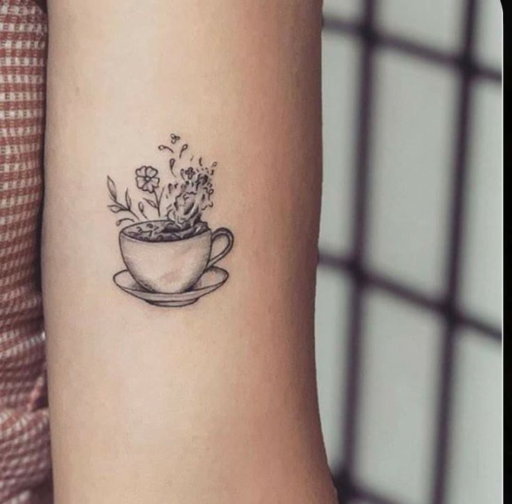 Black and gray minimalist tattoo of a teacup with flowers in it Teapot Tattoo, Coffee Cup Tattoo, Tattoo Cafe, Tea Tattoo, Teacup Tattoo, Tattoo With Flowers, Gray Minimalist, Cup Tattoo, Full Tattoo