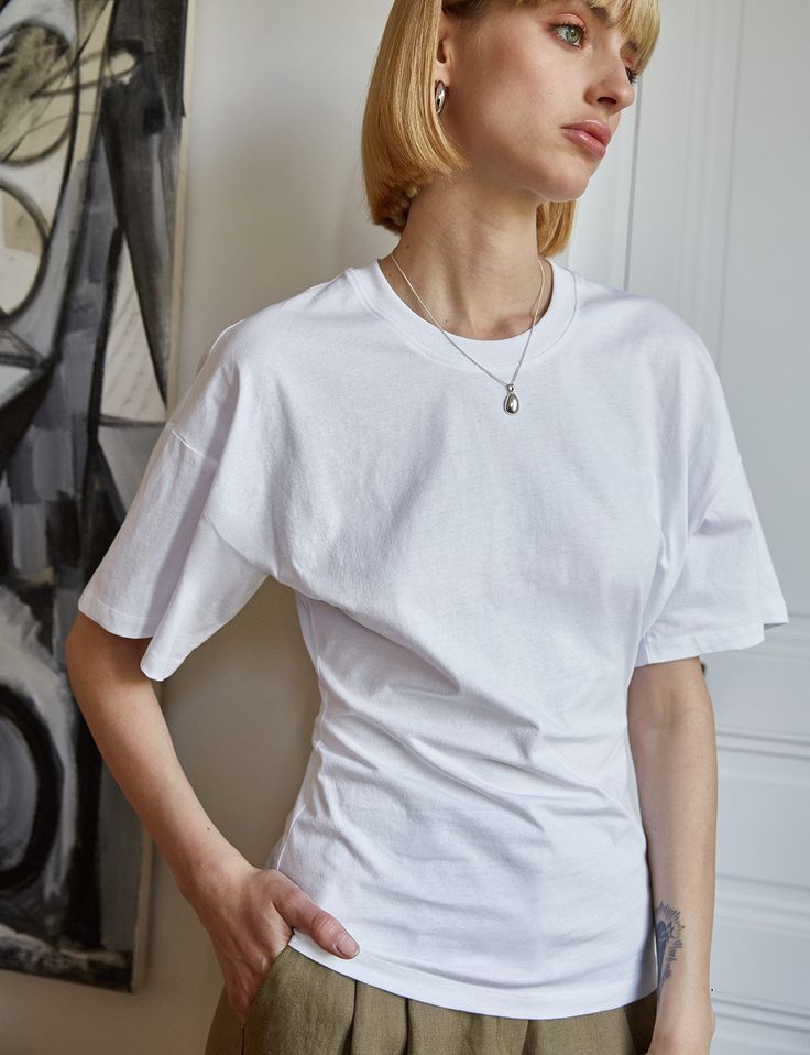 White cotton batwing sleeve tee with a a sculptural, cinched-in waist. Brand Pixie Market100% cottonNot sheerDropped shouldersHourglass shapeSize XS bust 34", waist 24"Size S bust 36", waist 26"Size M bust 38", waist 28"Size L bust 40", waist 30"Length 26"Model is wearing a size small Portugal Fits, Summer 24, Batwing Sleeve, Cinched Waist, Dream Wardrobe, White Cotton, Athleisure, White Undershirt, Chef's Jackets