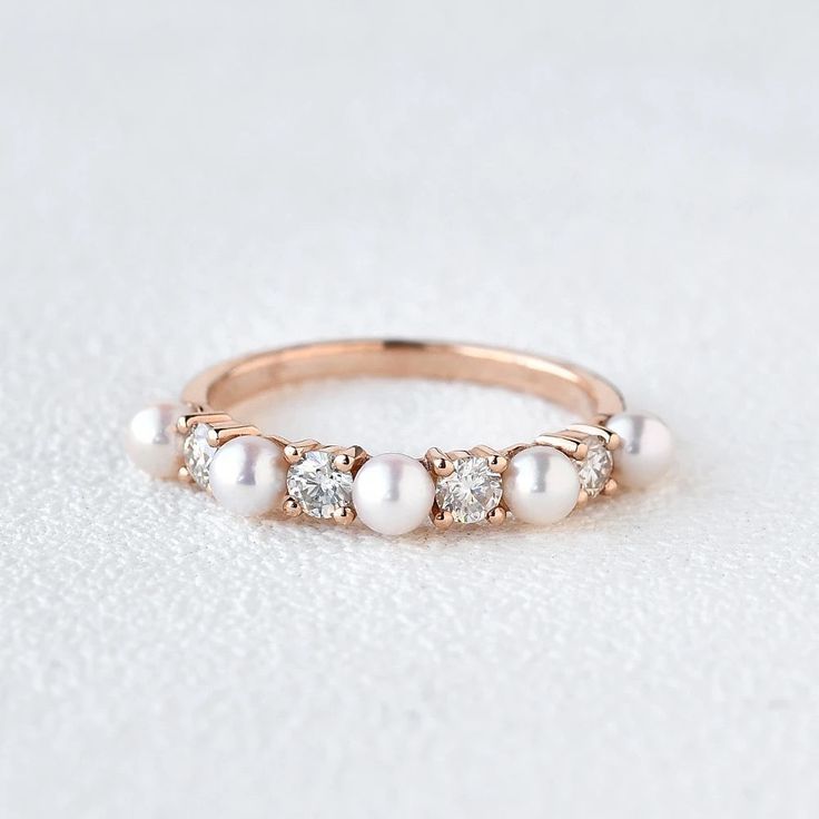 an image of a ring with pearls on it