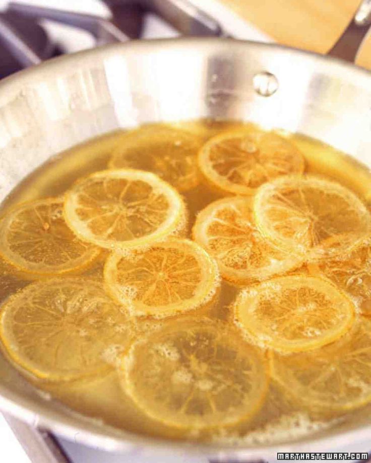 a pan filled with lemon slices on top of a stove