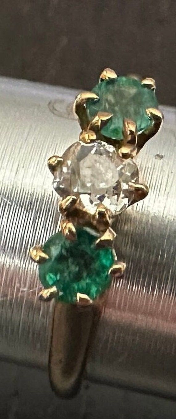 Antique 14K Emerald & Diamond ring size 6, weight 2.2 grams.  Antique old white European cur center Diamond(4mm-approx 1/4 carat) with two genuine richly colored deep green Emeralds on each side-High prong setting.  The classic trinity horizontal design. Antique Emerald Diamond Ring For Formal Occasions, Antique Round Emerald Ring With Diamonds, Antique Green Oval Diamond Ring, Vintage Emerald Diamond Ring With Hallmark, Antique Green Diamond Ring For Formal Occasions, Antique 14k Stamped Emerald Ring, Antique Three Stone Round Jewelry, Antique Emerald Ring With Diamond For Anniversary, Antique Green Emerald Ring With Prong Setting