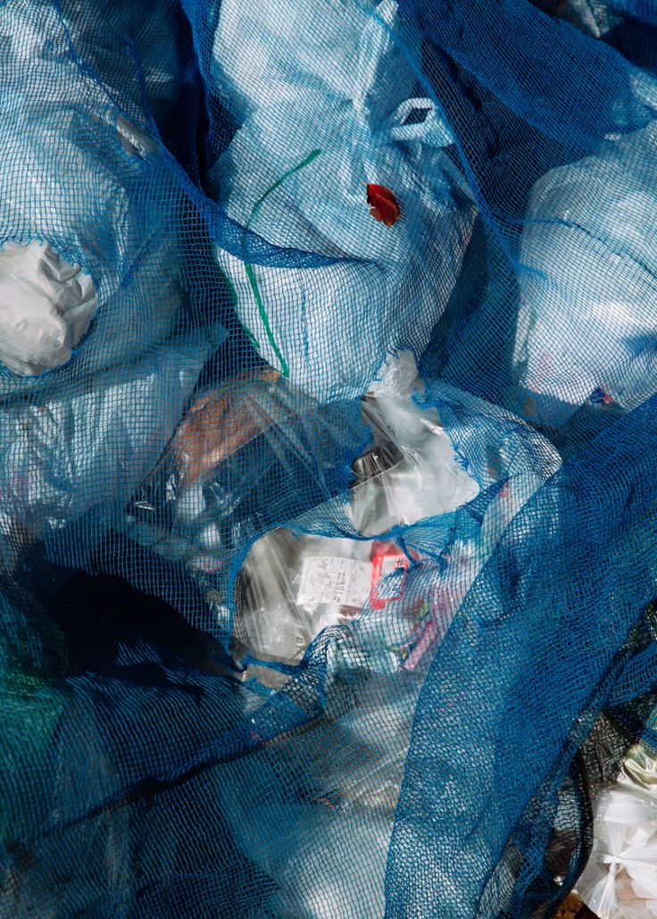 a pile of plastic bags filled with trash