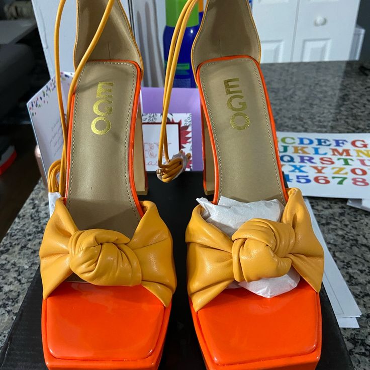 Orange And Yellow Fun Strappy Heel Brand New Never Worn. Fits Larger Than An 8 Yellow Platform Heels For Party, Yellow Pointed Toe Sandals With Padded Heel, Yellow Sandals With Padded Heel And Pointed Toe, Chic Yellow Square Toe Sandals, Yellow Platform High Heels, Yellow Party Heels With Padded Heel, Yellow Heels With Padded Block Heel, Yellow Block Heels With Padded Heel, Yellow Heels With Wrapped Heel For Party