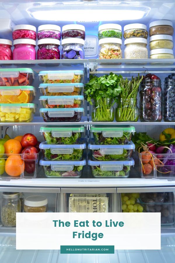 an open refrigerator filled with lots of different types of vegetables and fruit in it's doors