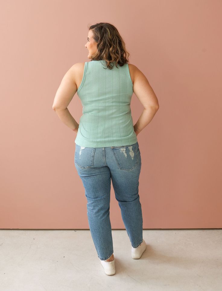 Add a splash of color to your outfit in our KADI tank top. This beautiful tank features a pointelle knit fabric, v-neckline with button details. Fits true to size. Christina is 5'4" with a 34D Bust and is wearing a M (her true to size). S: 28" Bust (stretchy), 23.75" Length M: 30" Bust (stretchy), 24" Length L: 32" Bust (stretchy), 24.25" Length Material: 85% Polyester, 15% Rayon Detail: Soft, stretchy fabrication Tailored fit Care: Handwash cold Casual V-neck Pointelle Knit Tank Top, Trendy Pointelle Knit Tank Top For Spring, Spring Trendy Pointelle Knit Tank Top, Spring Sleeveless Pointelle Knit Camisole, Fitted Cotton Pointelle Knit Tank Top, Cotton Pointelle Knit Sleeveless Tank Top, Fitted V-neck Casual Tank Top, Fitted Pointelle Knit Tank Top For Spring, Casual Pointelle Knit Tank Tops