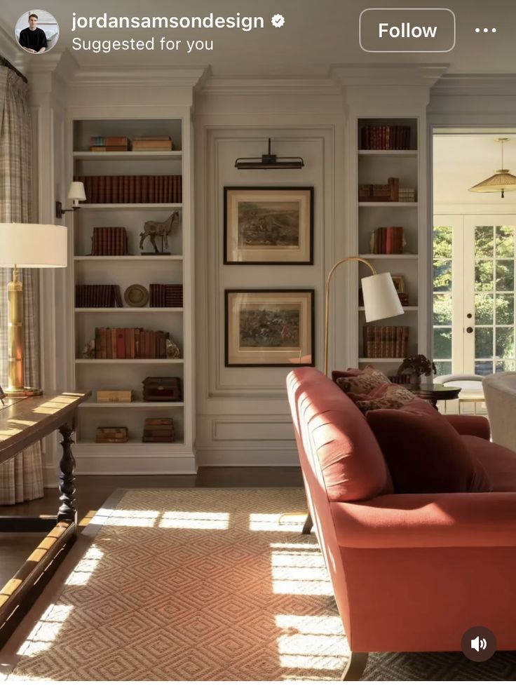 a living room filled with furniture and bookshelves