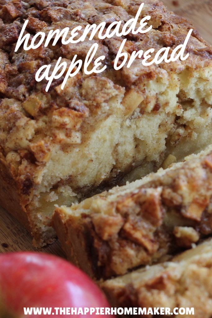 homemade apple bread sliced and sitting on a cutting board